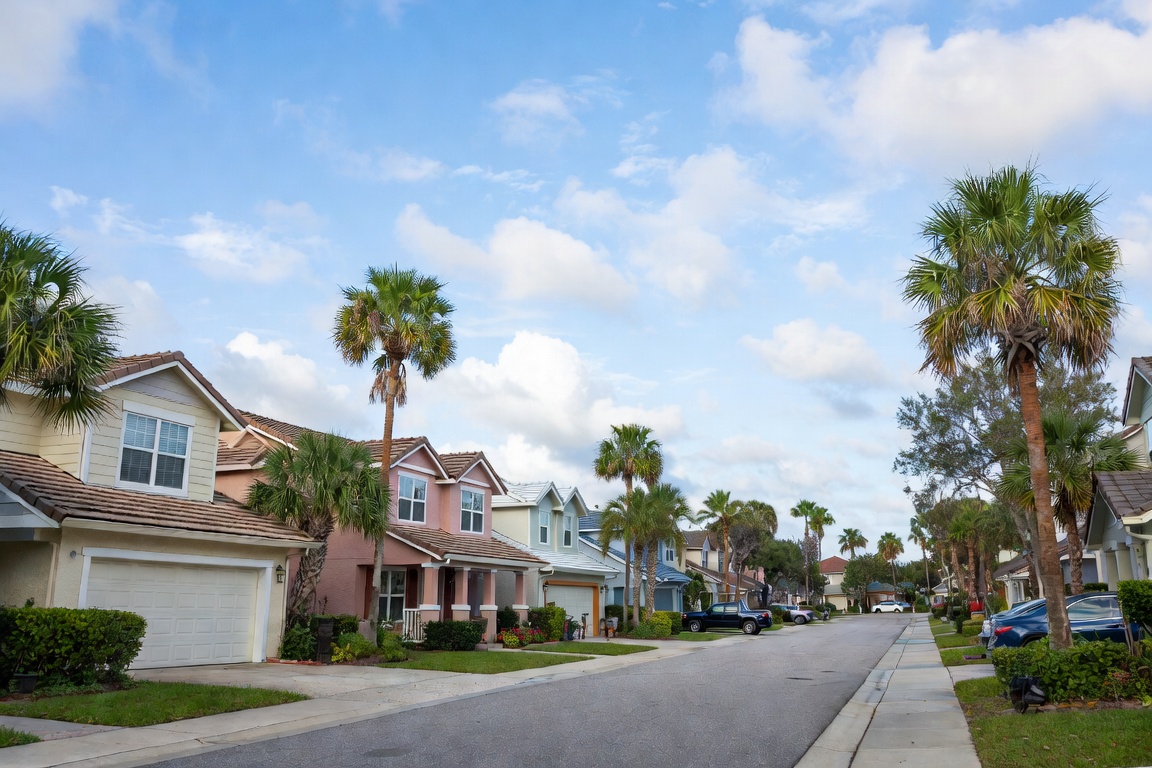 Residential neighborhood in Melbourne, Florida with palm trees and Florida homes